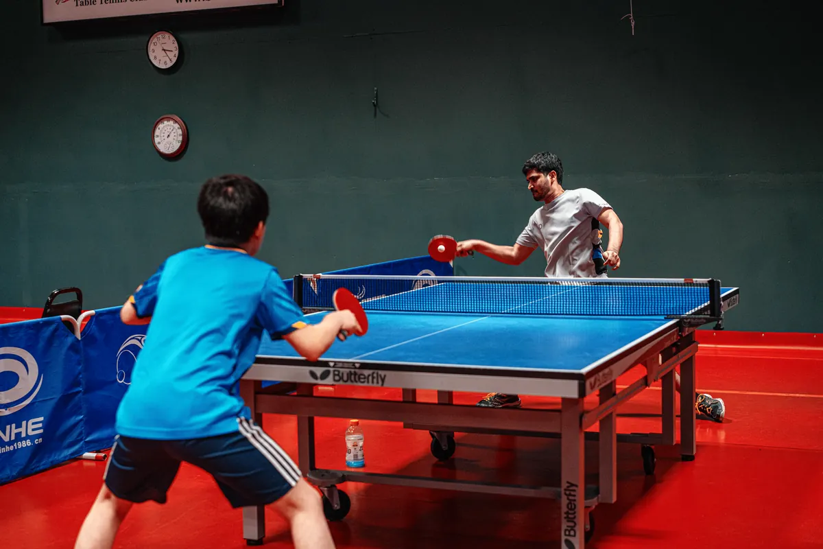 Abhi returning a shot in a table tennis rally